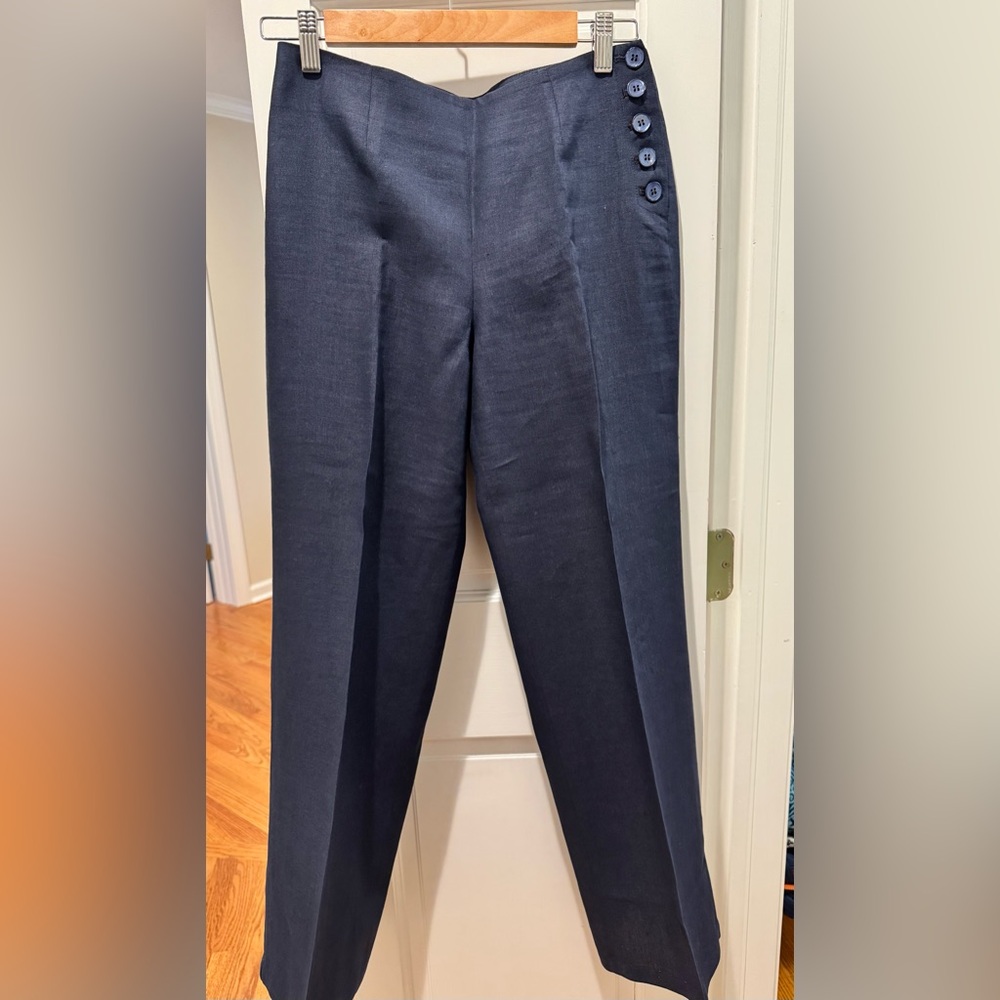 Woman’s linen pants with side and back button details.